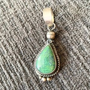 Sterling silver and turquoise pendant.